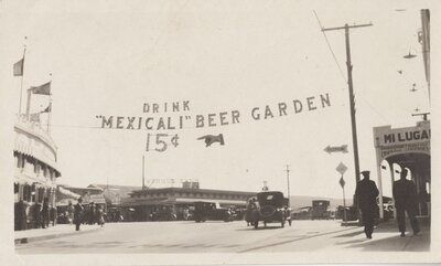 Tijuana street scene showing "Drink Mexicali Beer Garden" banner sign