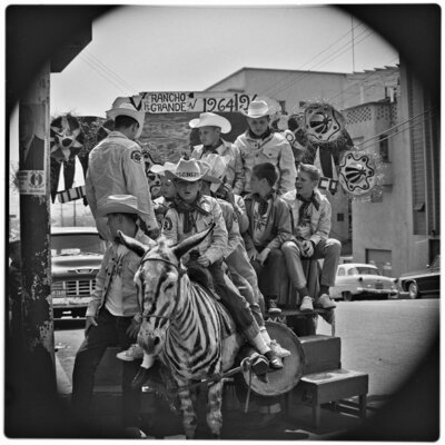 Members of the Royal Rangers Christian youth organization, posing for a photograph astride a typical Tijuana burro on Avenida Revolución
