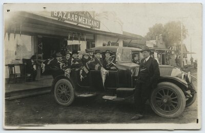 Automobile passengers outside the Bazaar Mexicano