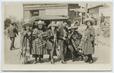 Tourists in Mexican costume near U.S.-Mexico border station