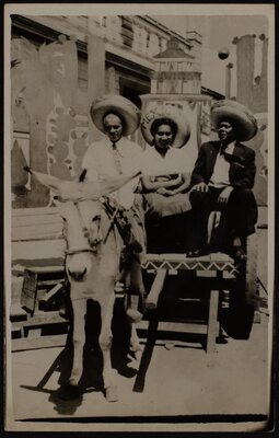 Three tourists in a burro cart in Tijuana, Mexico